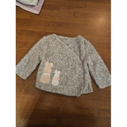 Pull cache coeur gris...