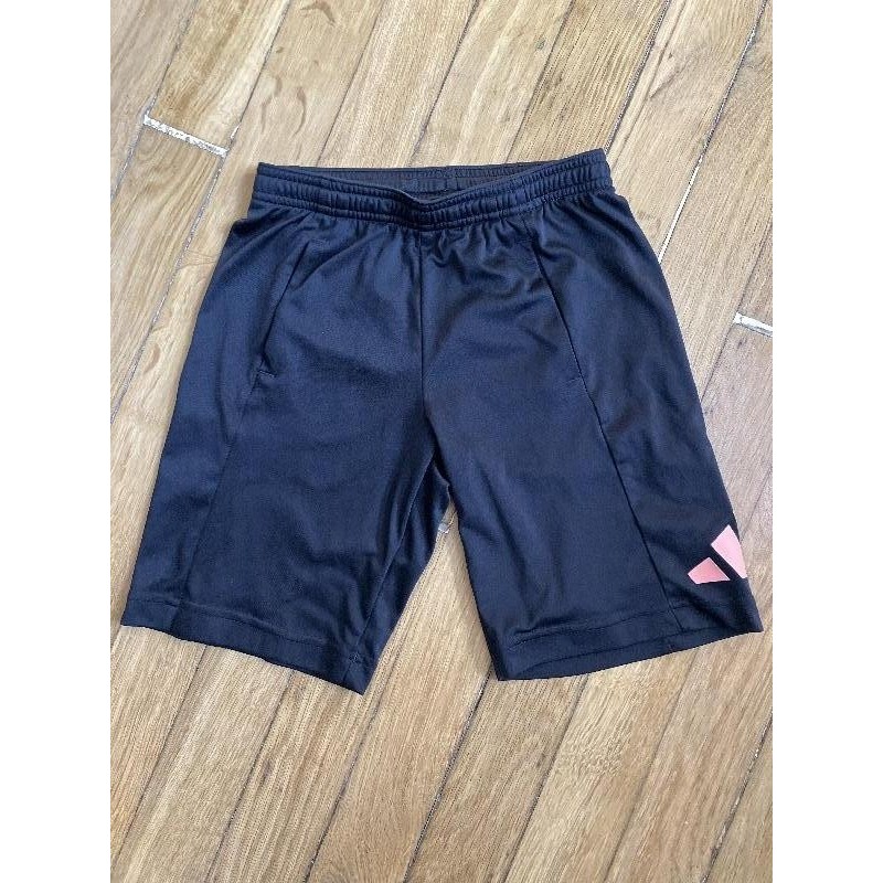 Short noir/orange Adiddas 9-10ans